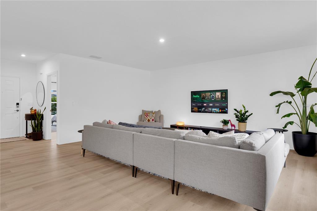 4226 Southern Vista Loop St. Cloud, FL 34772 - Photo 9 of 39 a living room with furniture and a potted plant