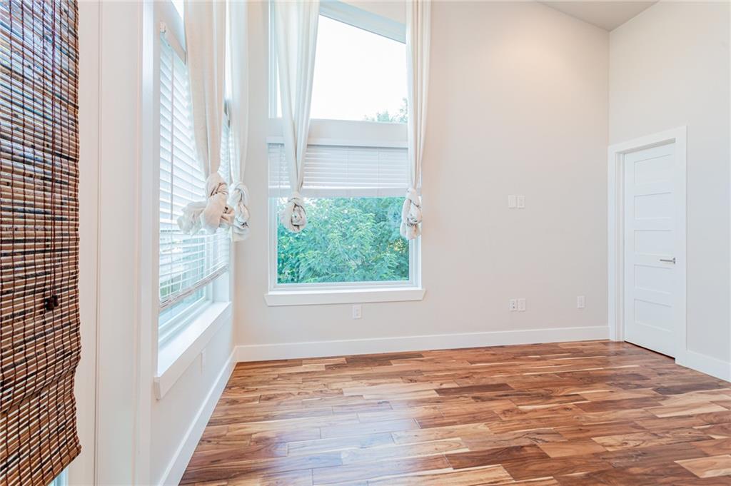2509 Del Curto Road, Unit B Austin, TX 78704 - Photo 14 of 31 Empty room featuring wood finished floors and baseboards