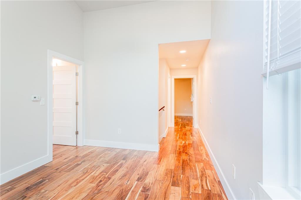 2509 Del Curto Road, Unit B Austin, TX 78704 - Photo 15 of 31 Corridor with light wood-type flooring and baseboards