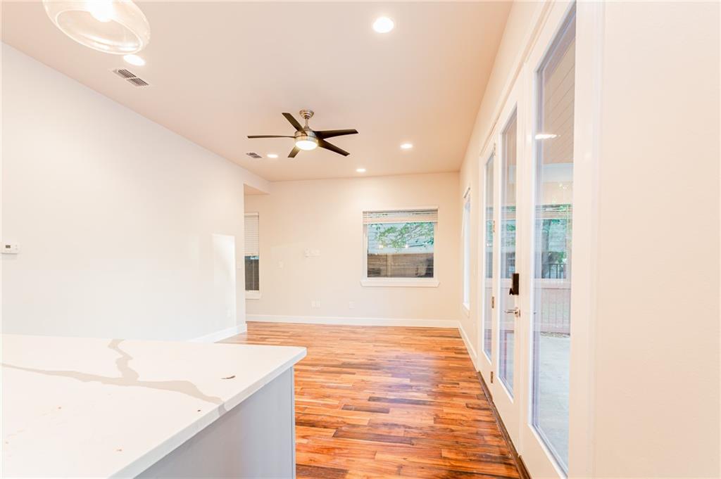 2509 Del Curto Road, Unit B Austin, TX 78704 - Photo 17 of 31 Hall featuring light wood-type flooring, visible vents, french doors, and recessed lighting
