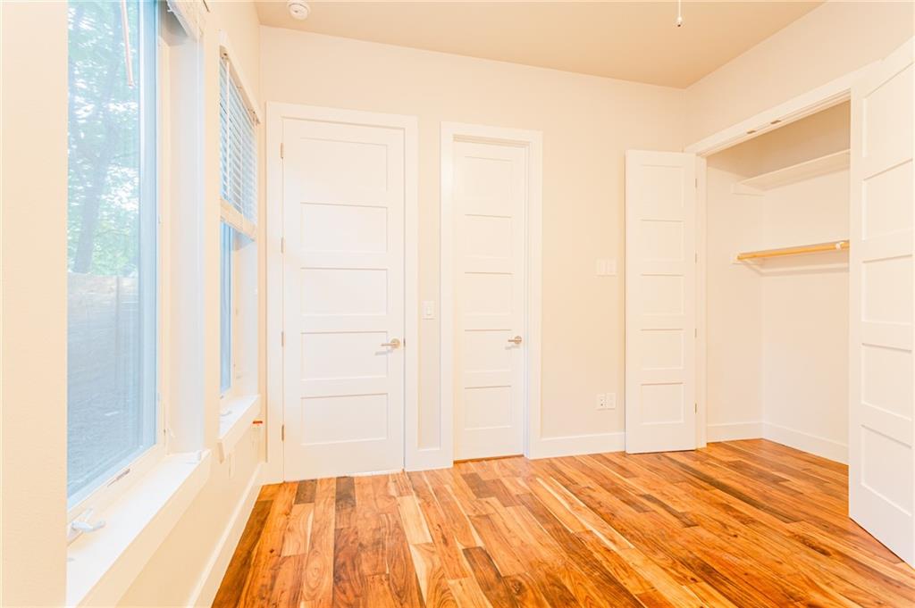 2509 Del Curto Road, Unit B Austin, TX 78704 - Photo 20 of 31 Unfurnished bedroom with baseboards and light wood-style floors