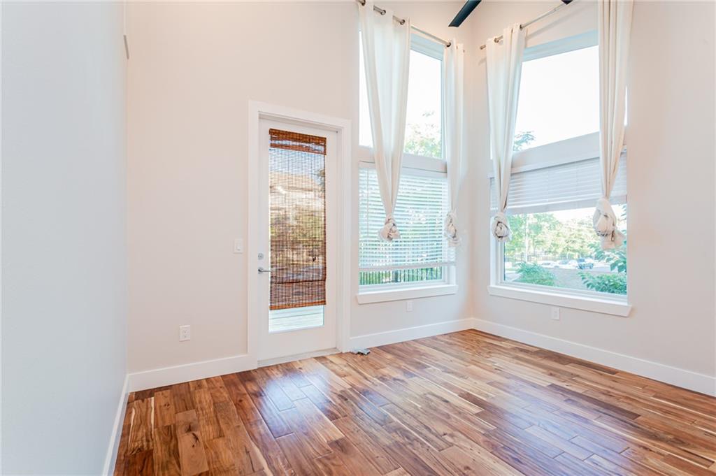 2509 Del Curto Road, Unit B Austin, TX 78704 - Photo 21 of 31 Doorway featuring baseboards and wood finished floors