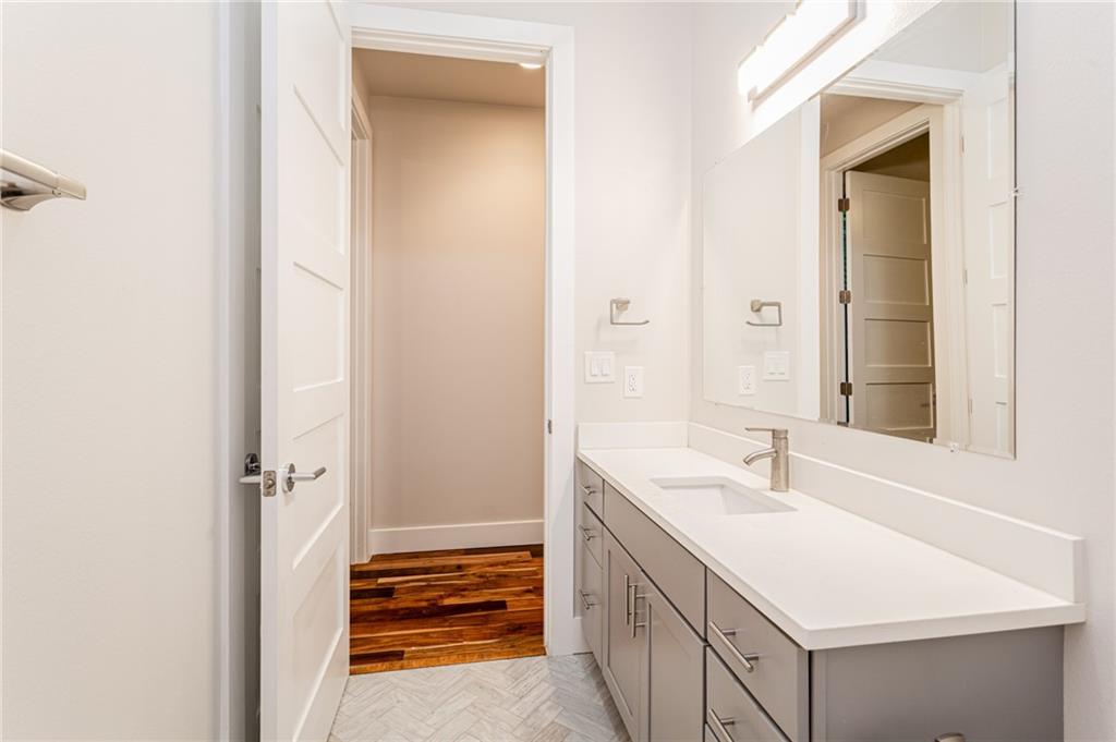 2509 Del Curto Road, Unit B Austin, TX 78704 - Photo 24 of 31 Bathroom with baseboards, wood finished floors, and vanity