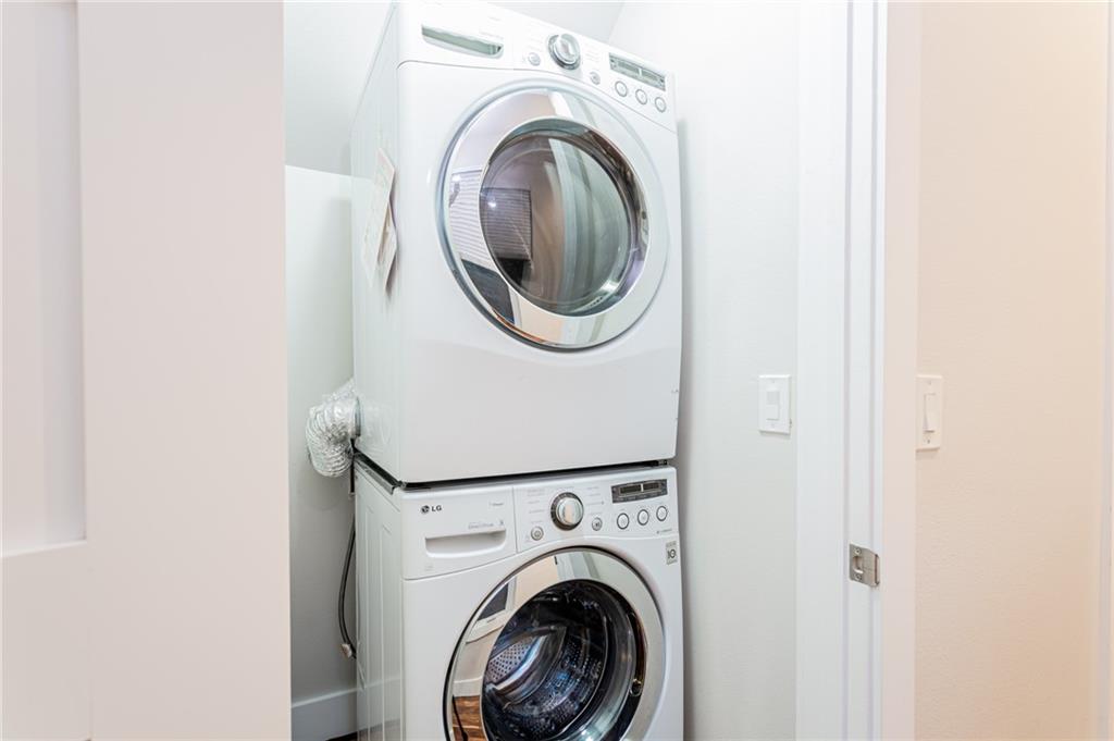 2509 Del Curto Road, Unit B Austin, TX 78704 - Photo 28 of 31 Laundry area featuring stacked washing maching and dryer and laundry area