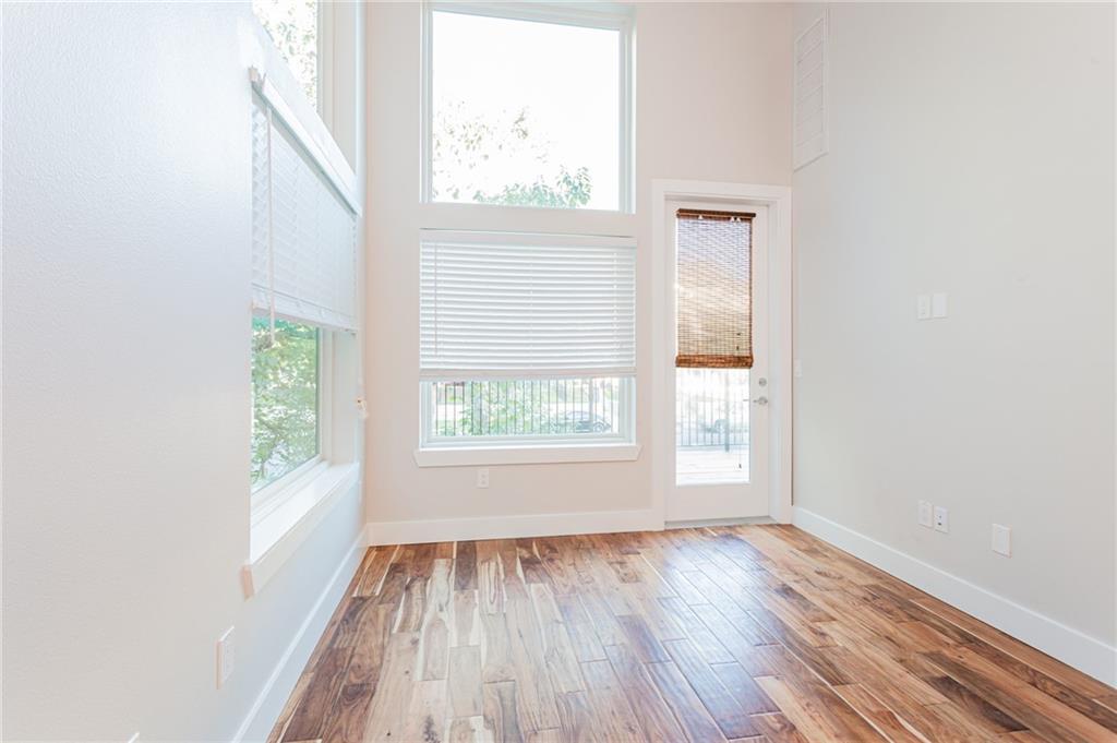 2509 Del Curto Road, Unit B Austin, TX 78704 - Photo 3 of 31 Spare room with baseboards and wood finished floors