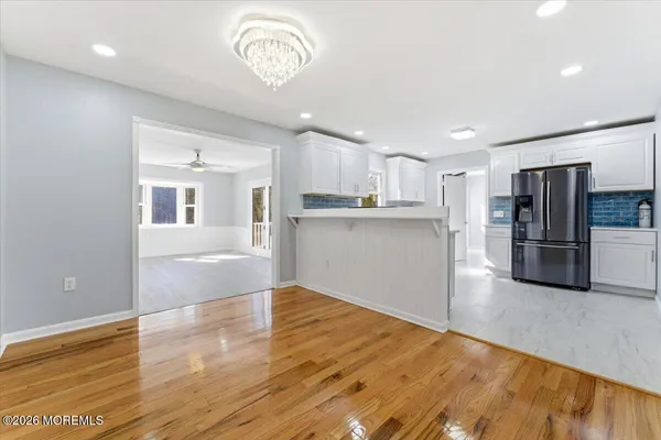 a view of kitchen with wooden floor