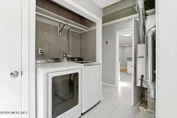 a view of bathroom with a shower and a sink