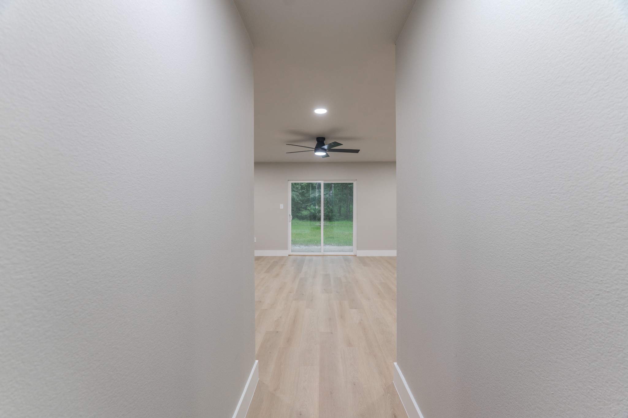 26701 Knottywood Oakhurst, TX 77359 - Photo 8 of 47 a view of wooden floor and a window in a room