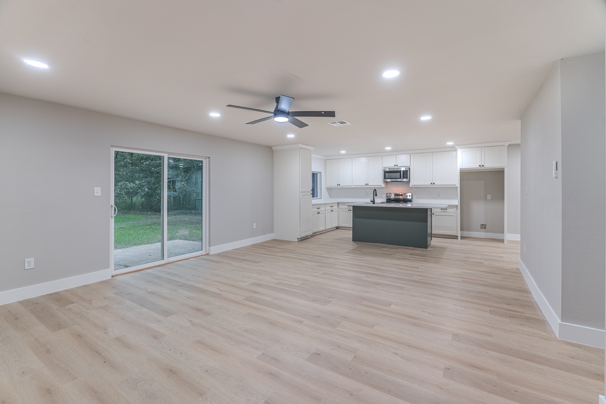 26701 Knottywood Oakhurst, TX 77359 - Photo 9 of 47 a view of a kitchen with a sink and a stove top oven