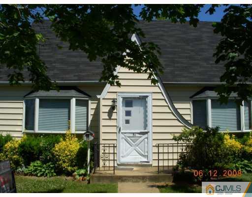 51 Helmetta Road Monroe Township, NJ 08831 - Photo 1 of 8 a view of a white house next to a yard