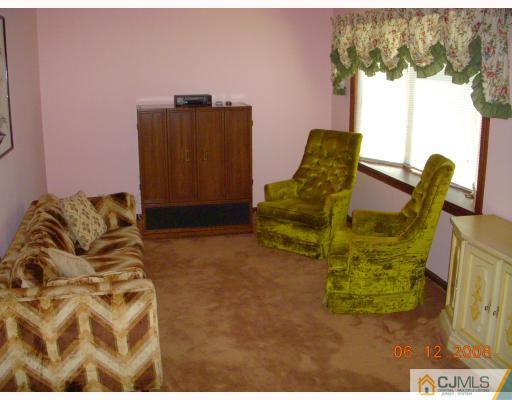 51 Helmetta Road Monroe Township, NJ 08831 - Photo 5 of 8 a living room with furniture and a window