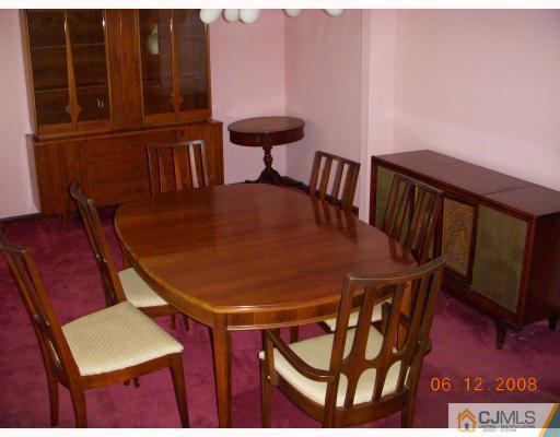 51 Helmetta Road Monroe Township, NJ 08831 - Photo 7 of 8 a view of a dining room with furniture and wooden floor