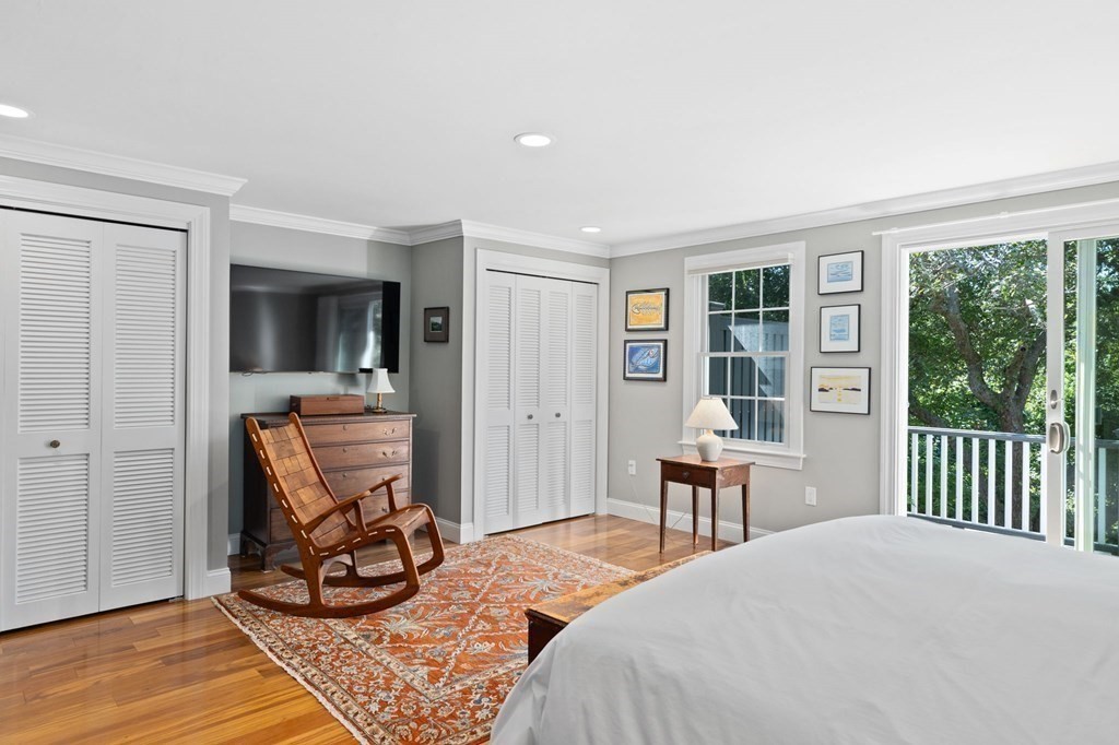 82 Thistle Patch Way, Unit 82 Hingham, MA 02043 - Photo 22 of 39 a bedroom with furniture a bed and large windows