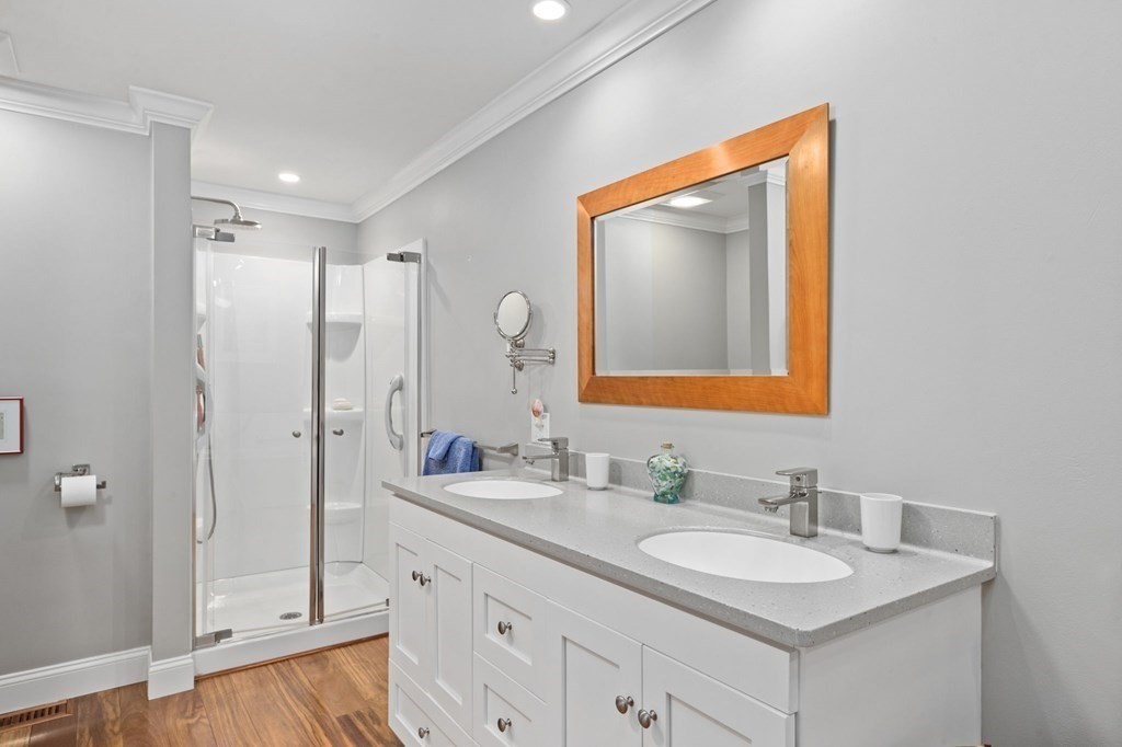 82 Thistle Patch Way, Unit 82 Hingham, MA 02043 - Photo 25 of 39 a bathroom with a double vanity sink mirror and shower