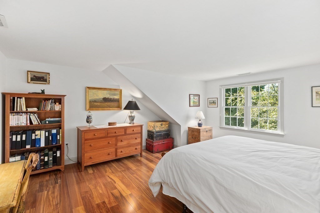 82 Thistle Patch Way, Unit 82 Hingham, MA 02043 - Photo 29 of 39 a bed room with a bed and a closet