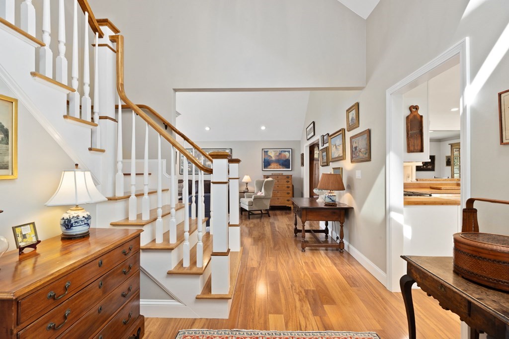 82 Thistle Patch Way, Unit 82 Hingham, MA 02043 - Photo 3 of 39 a living room with lots of furniture and a wooden floor