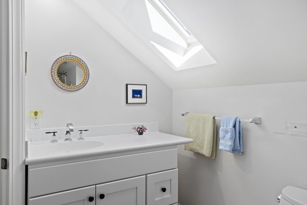 82 Thistle Patch Way, Unit 82 Hingham, MA 02043 - Photo 32 of 39 a bathroom with a sink and a mirror