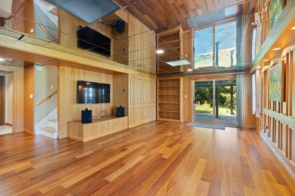 82 Thistle Patch Way, Unit 82 Hingham, MA 02043 - Photo 36 of 39 a view of a patio with wooden floor and a fireplace