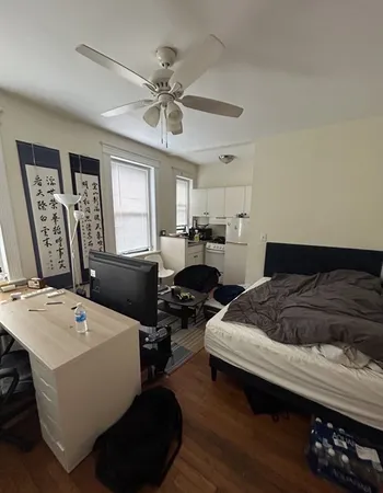 a bed room with furniture and a chandelier