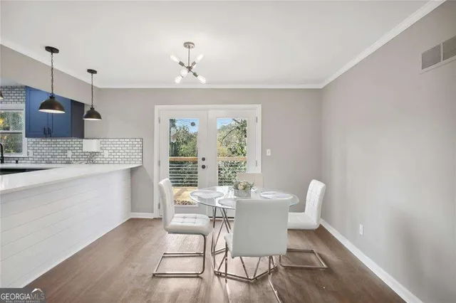 a view of a dining room with furniture window and outside view