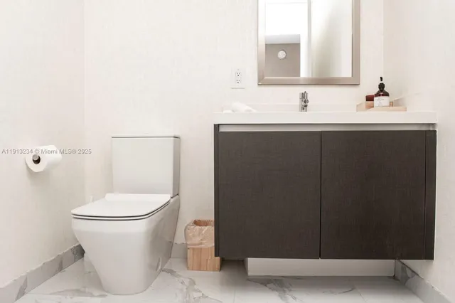 a close view of a sink and a mirror in a bathroom