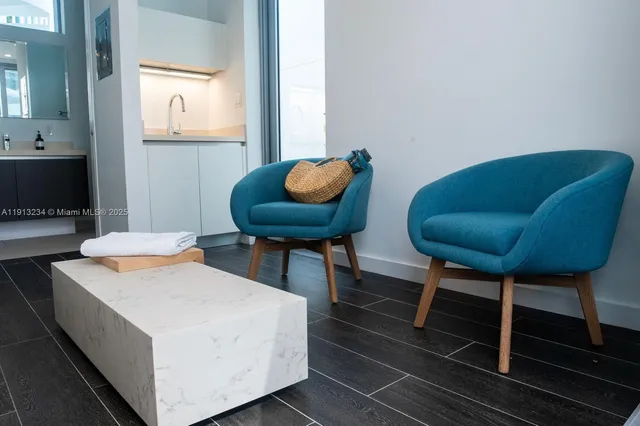 a living room with furniture and a chair