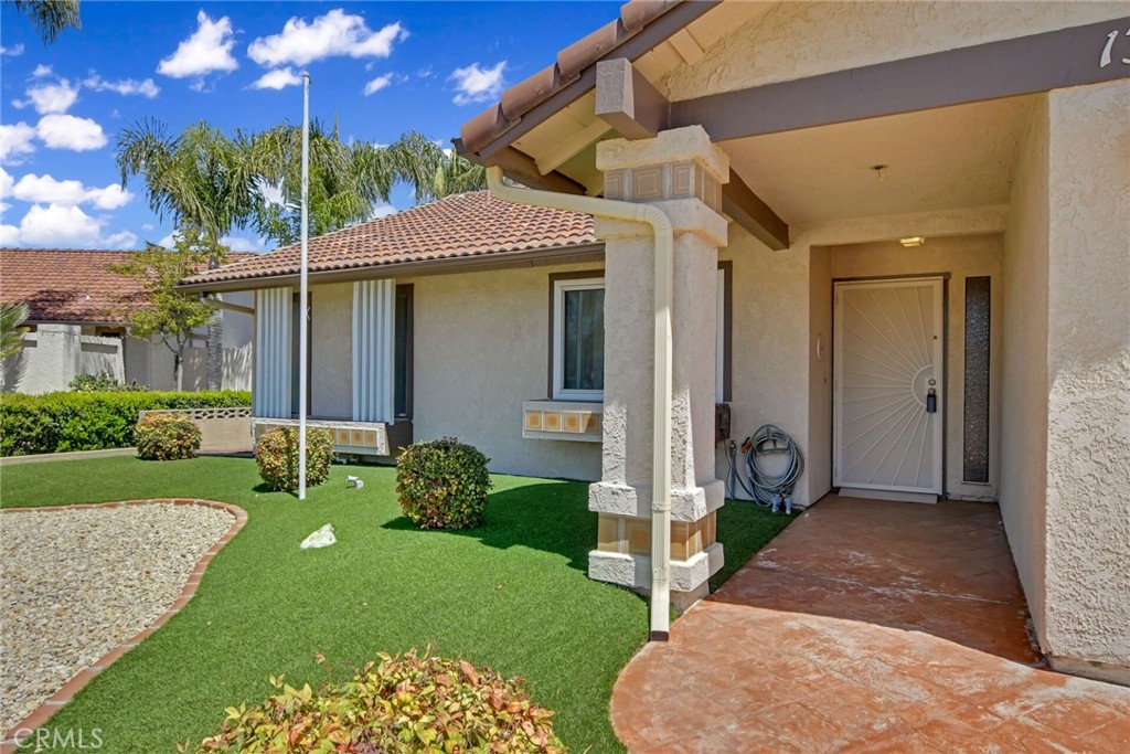 1300 Cherry Drive Hemet, CA 92545 - Photo 5 of 32 a front view of a house with garden