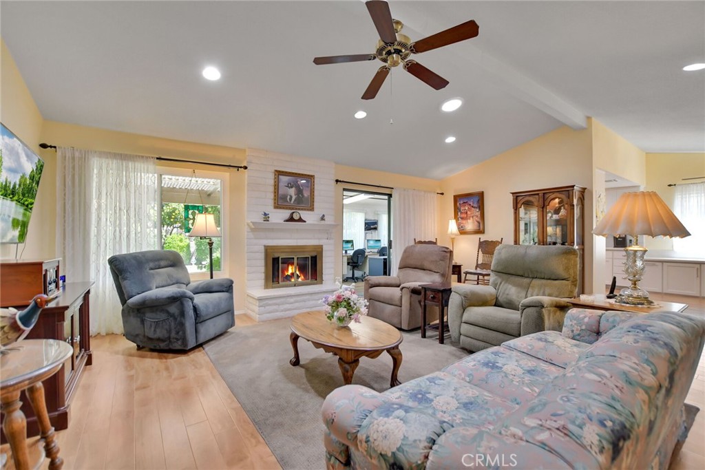 1300 Cherry Drive Hemet, CA 92545 - Photo 7 of 32 a living room with furniture a fireplace and a large window