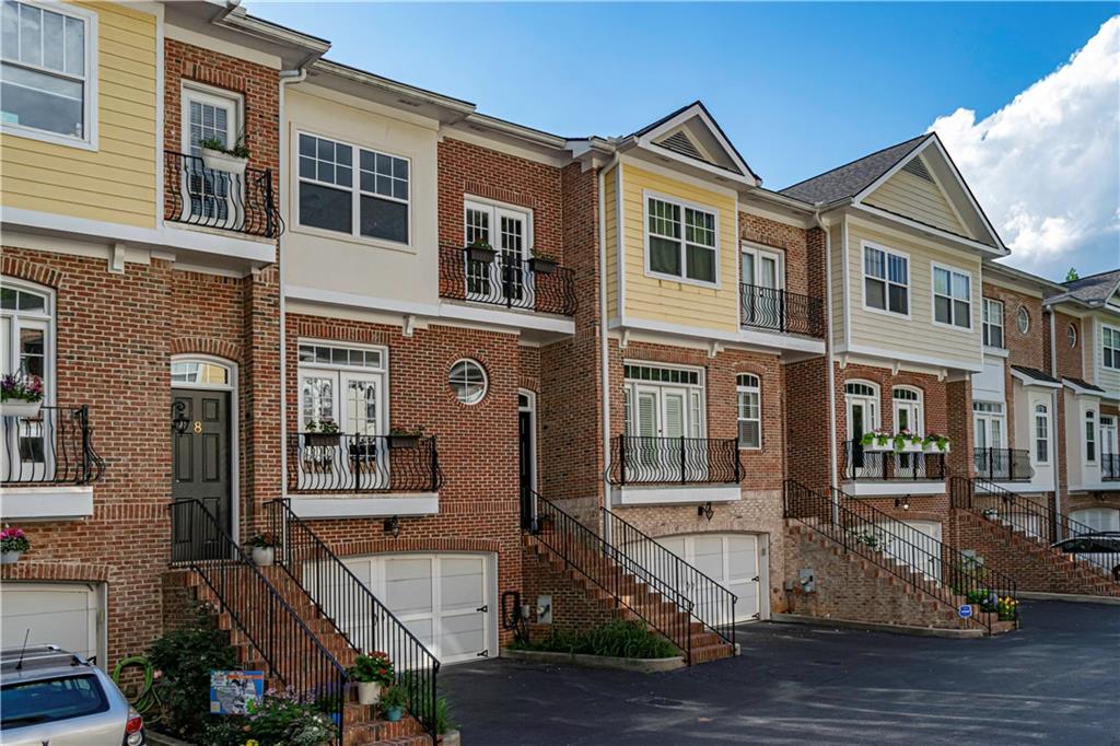1133 Scott Boulevard, Unit 7 Decatur, GA 30030 - Photo 1 of 1 a front view of a residential apartment building with a yard