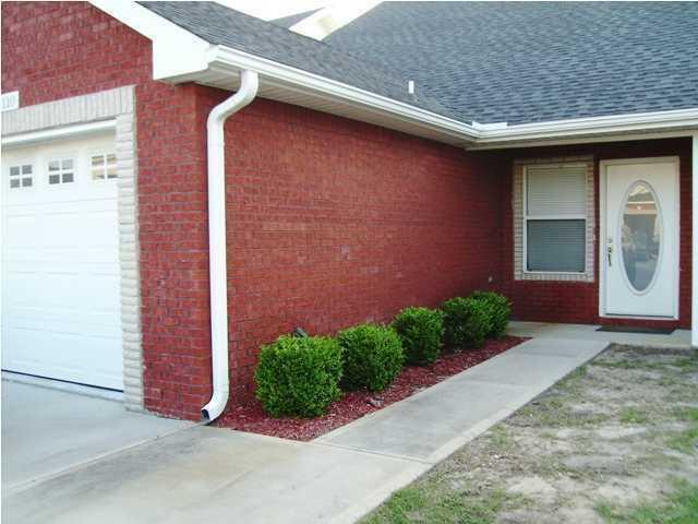 1150 Airport Road, Unit 110 Destin, FL 32541 - Photo 20 of 20 a front view of a house with garden