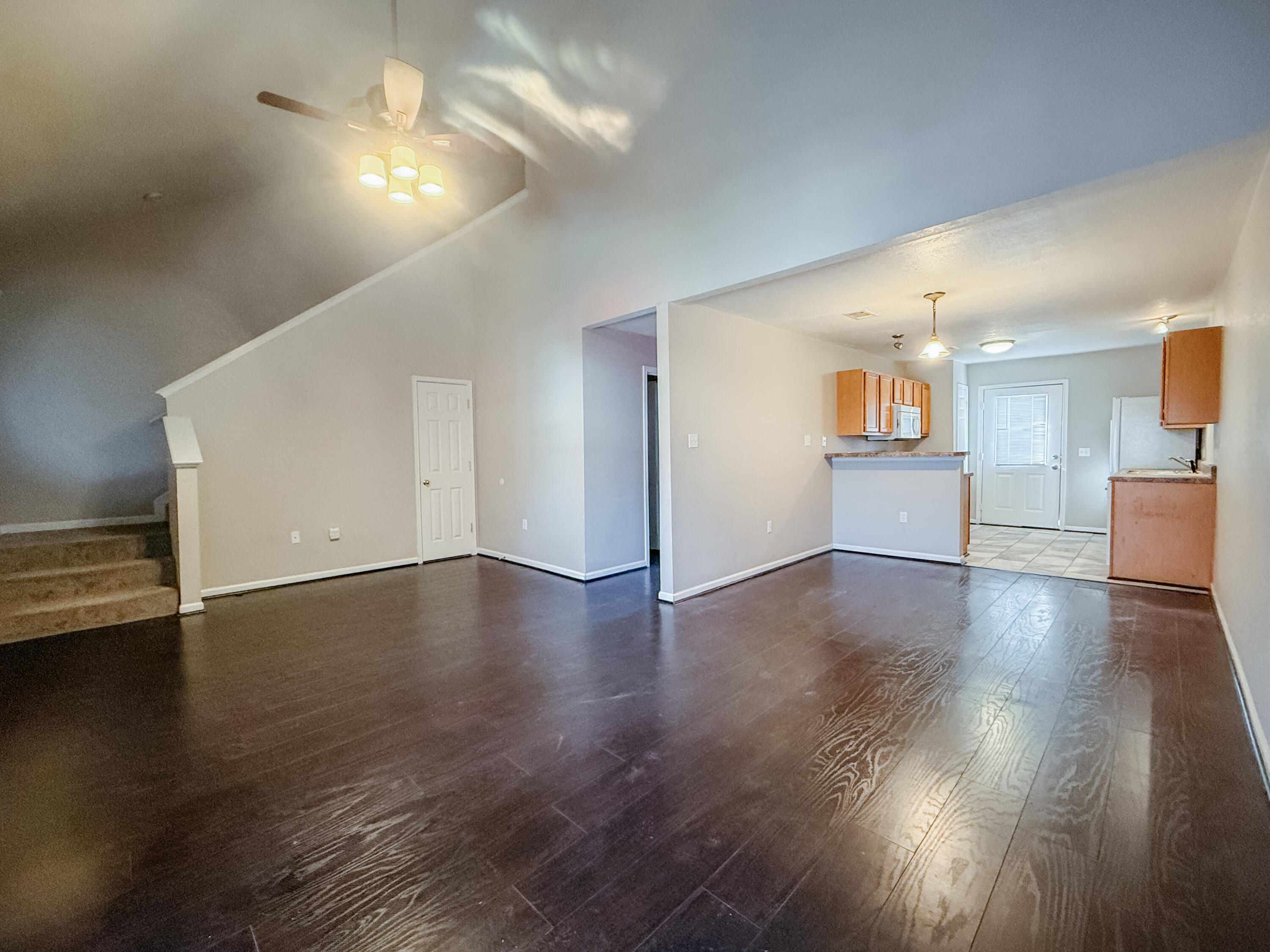 1150 Airport Road, Unit 110 Destin, FL 32541 - Photo 8 of 20 a view of a livingroom with furniture wooden floor and a window
