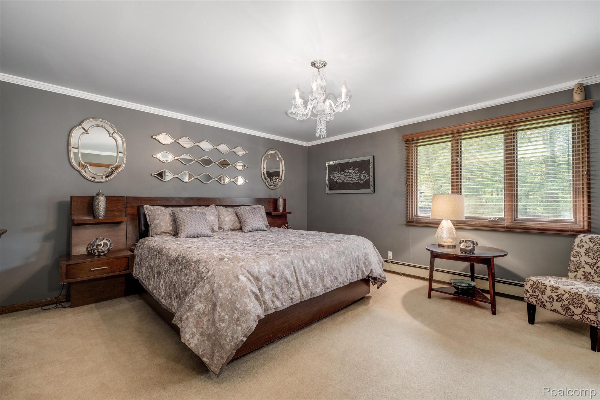 5262 North Livernois Road Rochester, MI 48306 - Photo 17 of 65 Primary bedroom with chandelier for ambience