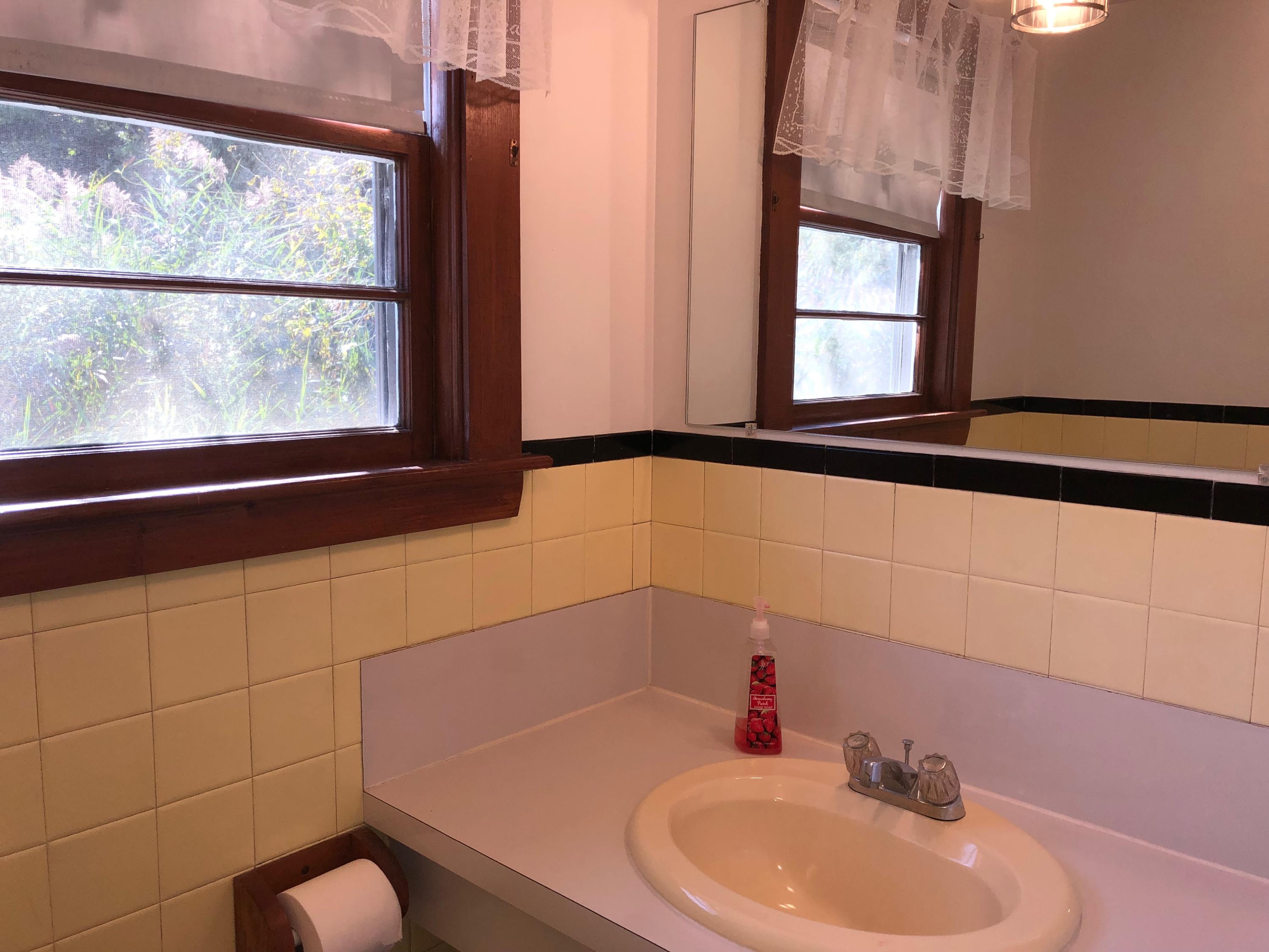 710 State Highway Eastham, MA 02642 - Photo 12 of 17 a bathroom with a sink and a window