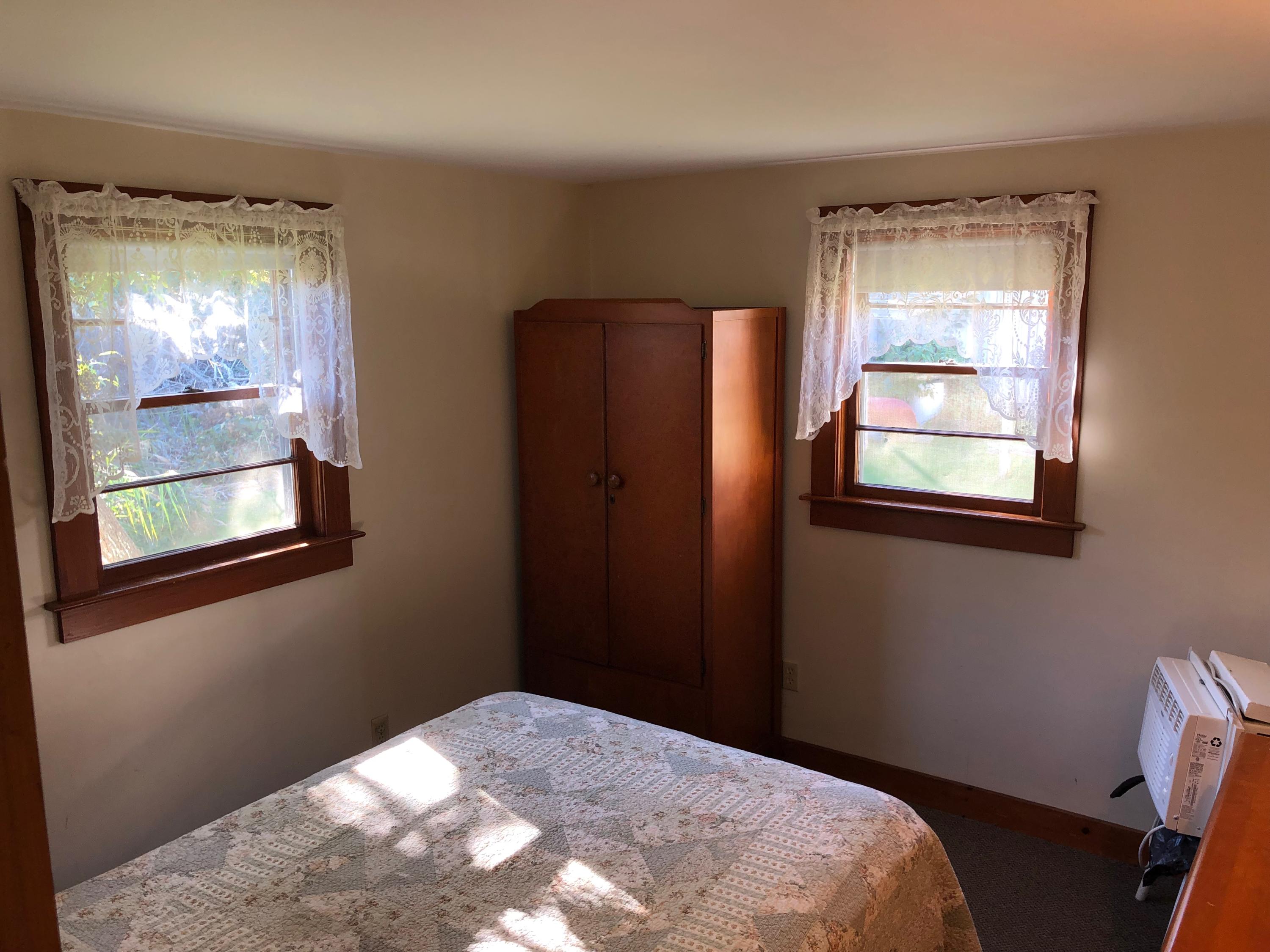 710 State Highway Eastham, MA 02642 - Photo 13 of 17 a bedroom with a bed and a window