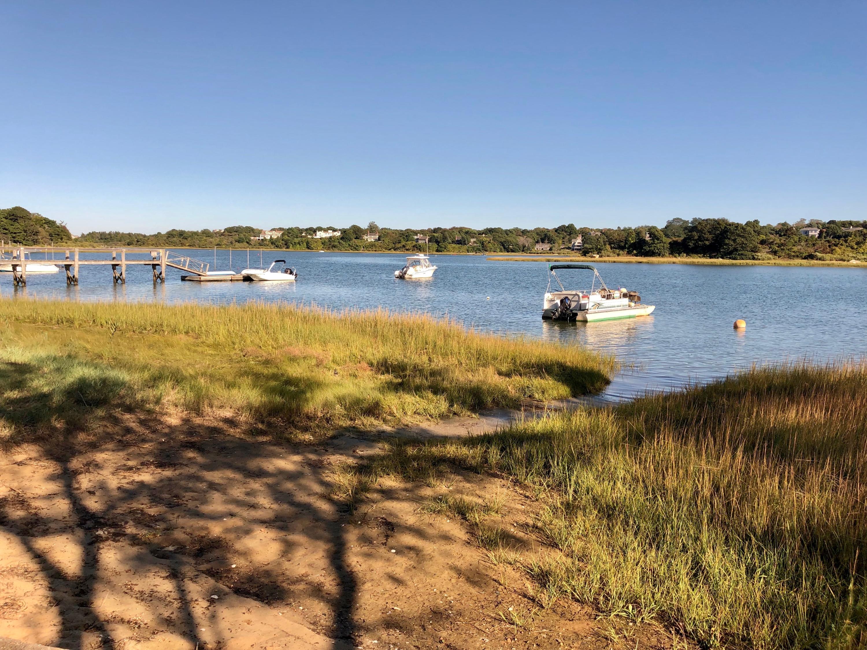 710 State Highway Eastham, MA 02642 - Photo 15 of 17 a view of a lake with houses in the back