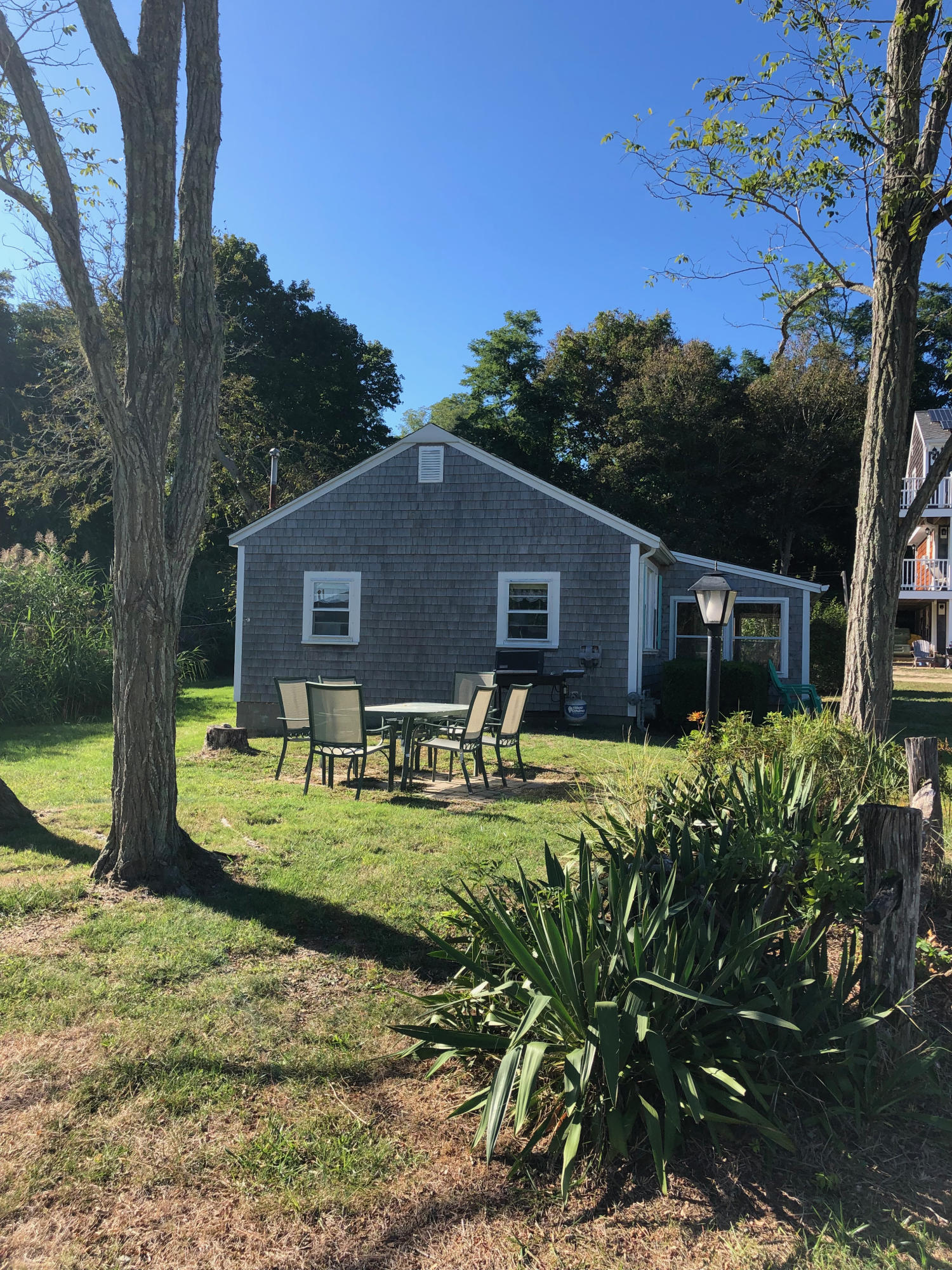 710 State Highway Eastham, MA 02642 - Photo 2 of 17 a front view of a house with garden