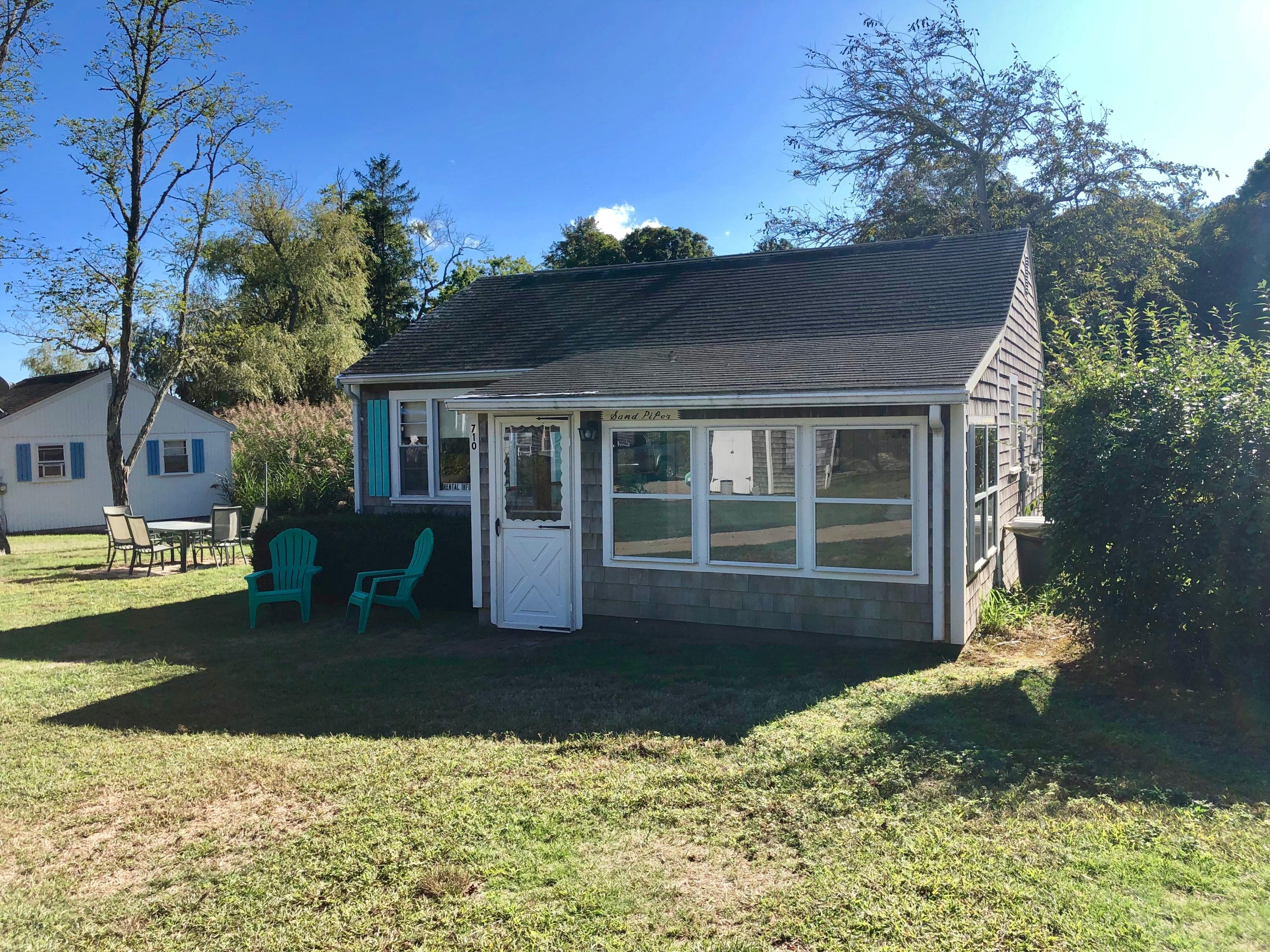 710 State Highway Eastham, MA 02642 - Photo 3 of 17 a front view of a house with garden