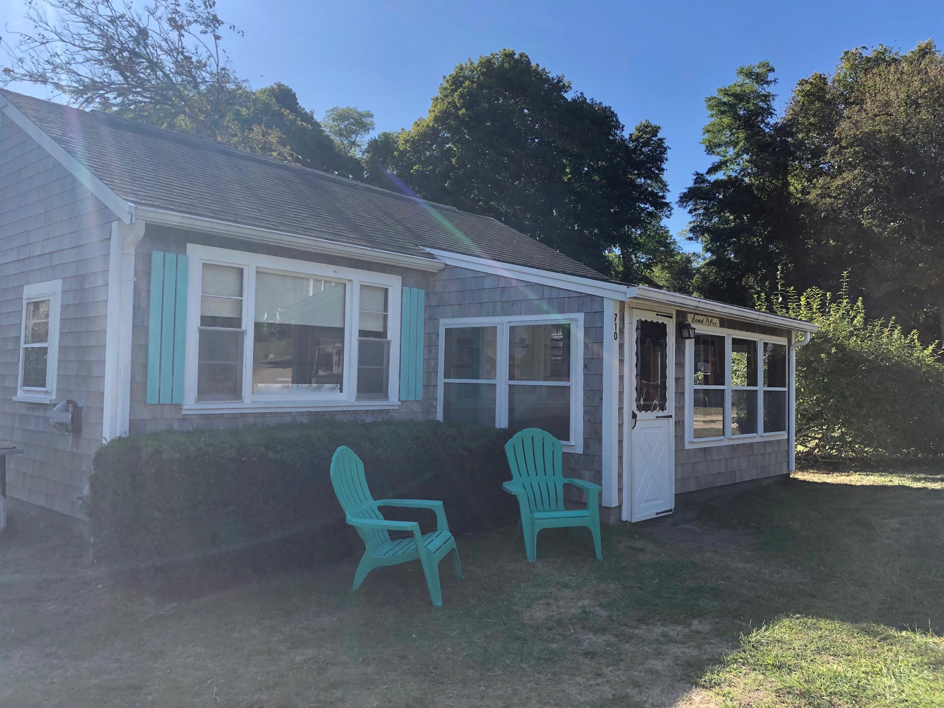 710 State Highway Eastham, MA 02642 - Photo 4 of 17 a view of a house with a yard and sitting area
