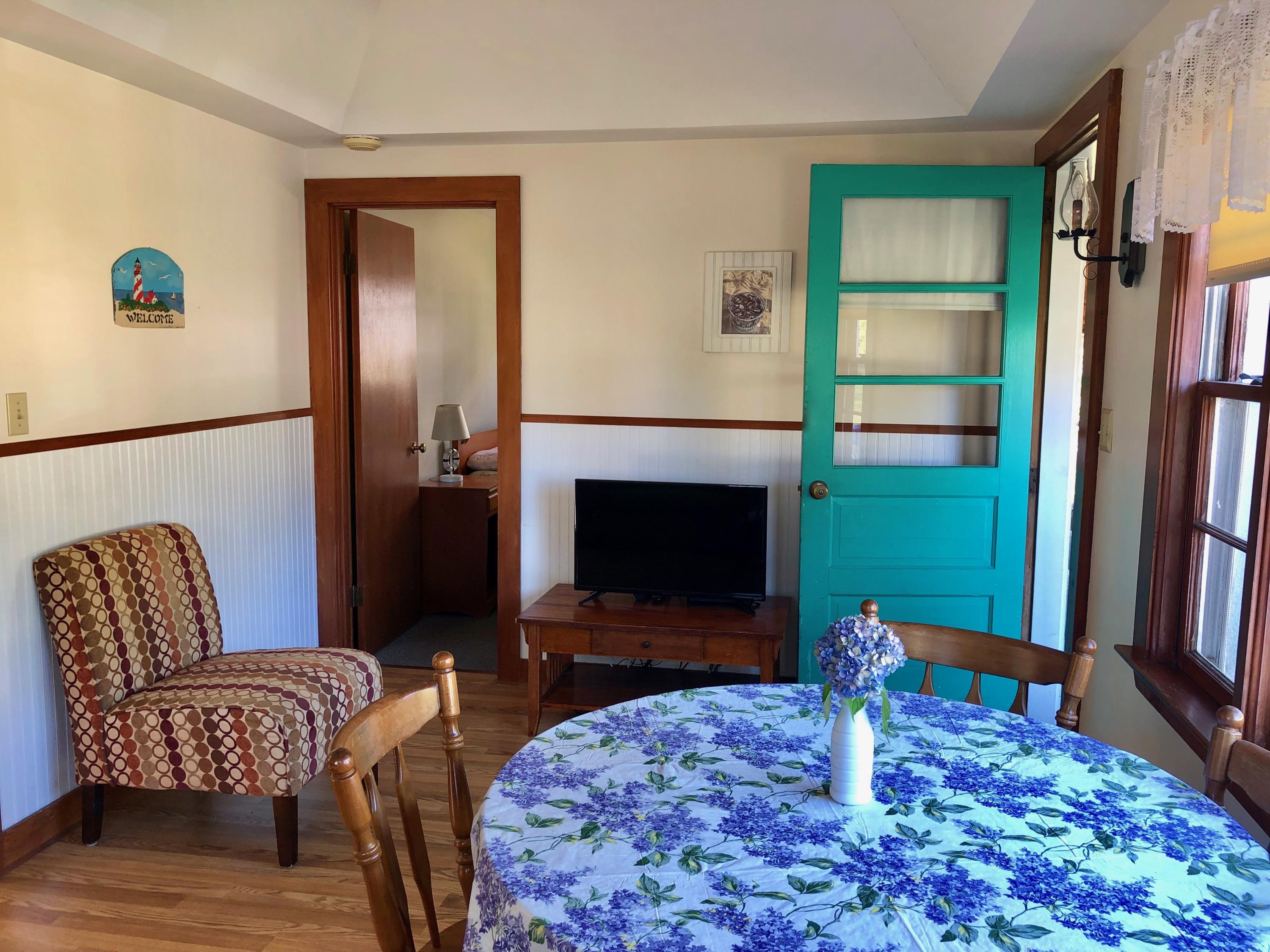 710 State Highway Eastham, MA 02642 - Photo 7 of 17 a living room with furniture and a flat screen tv