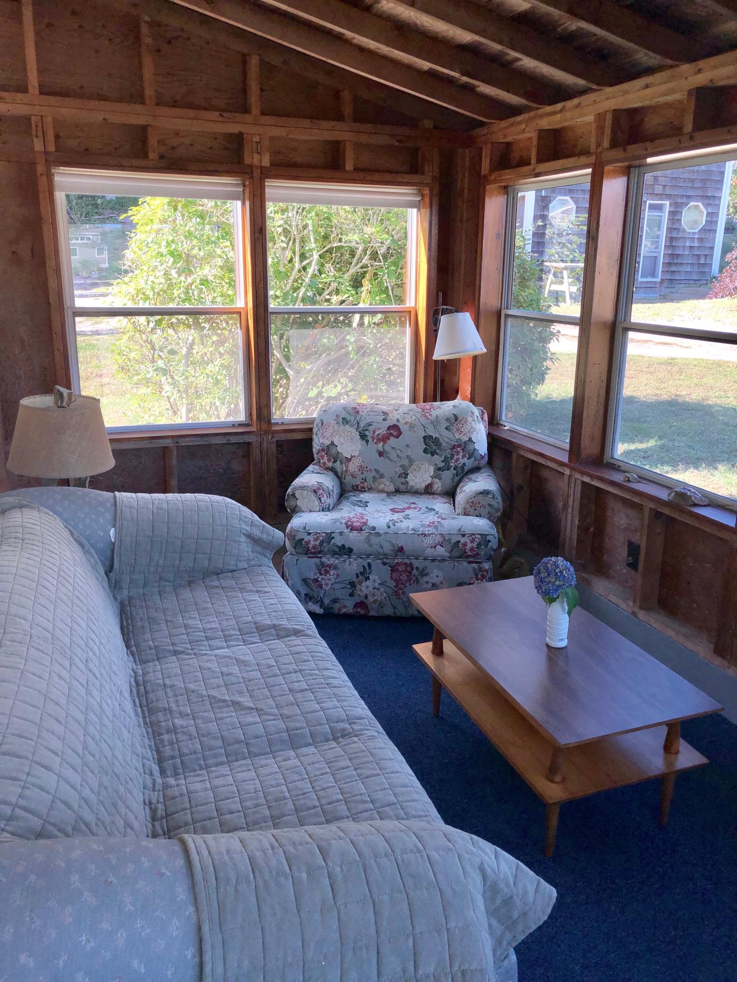 710 State Highway Eastham, MA 02642 - Photo 8 of 17 a bedroom with two beds and a large window