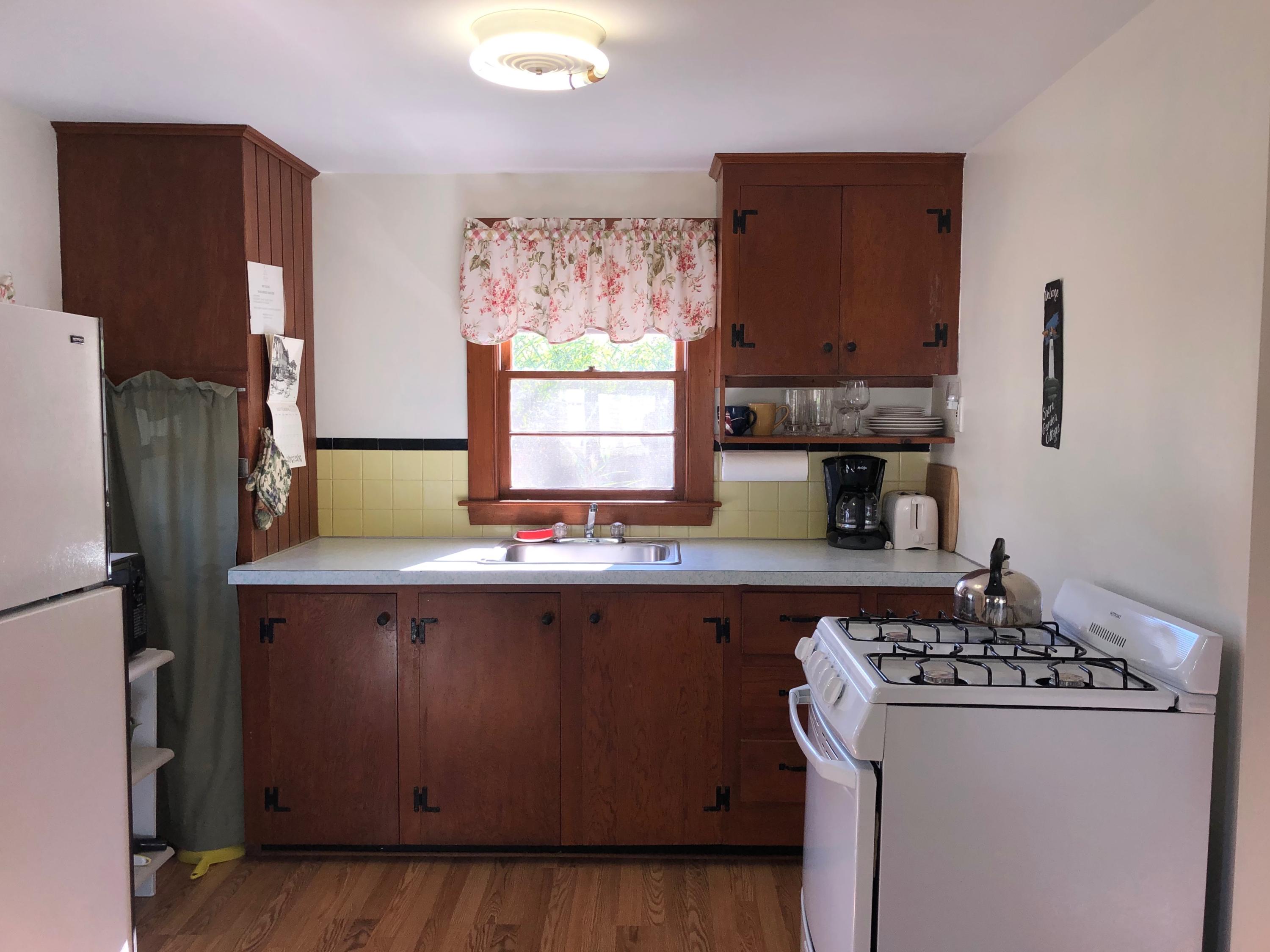 710 State Highway Eastham, MA 02642 - Photo 9 of 17 a kitchen with stainless steel appliances a stove a refrigerator and a counter space