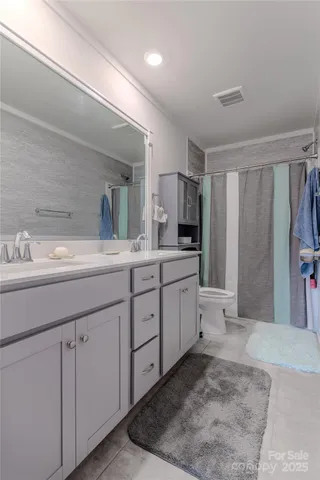 a spacious bathroom with a sink a mirror and a bathtub