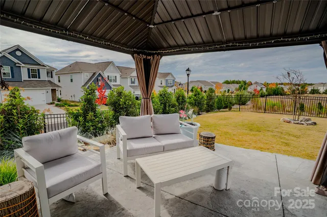 a view of an outdoor sitting area with furniture