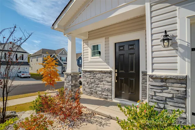 a white toilet sitting next to a bathroom sink and vanity