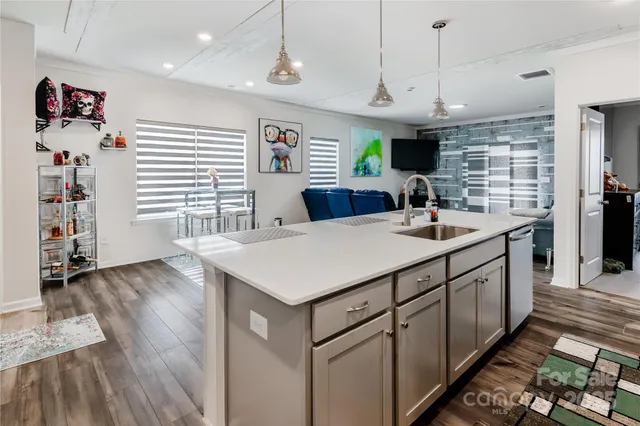 a kitchen with stainless steel appliances kitchen island a large island in the center