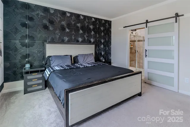 a bed sitting in a room next to a cabinet