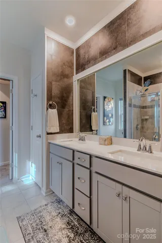 a bathroom with a double vanity sink and a mirror