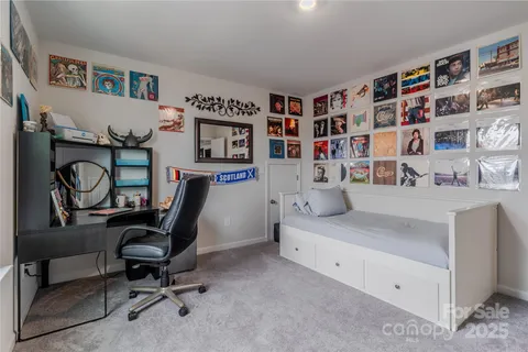 a bedroom with baby crib and a window