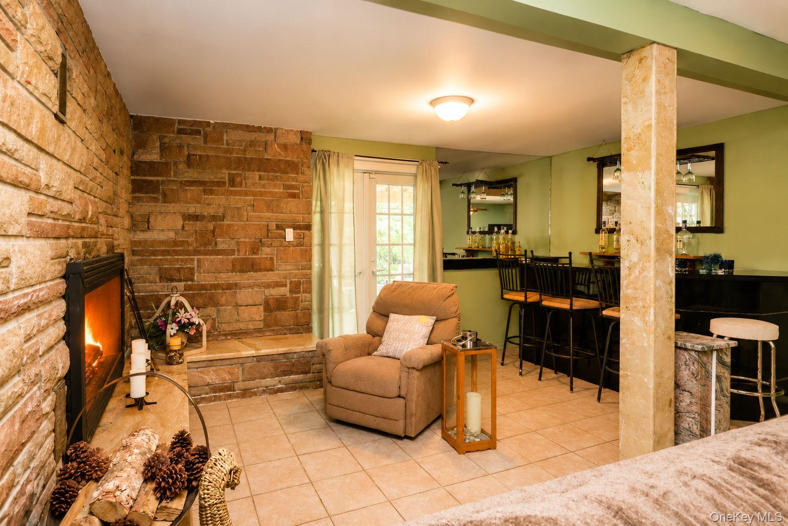 111 Ludvigh Road Bardonia, NY 10954 - Photo 25 of 44 Lower Level Family Room with tile floor, fireplace and bar.
