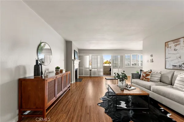 a living room with furniture fireplace and a table